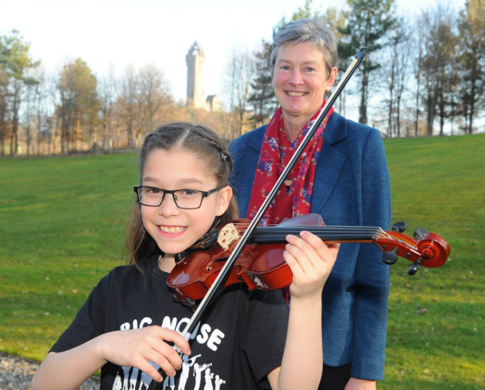 Centre Director Brigid Daniel with Big Noise viola player Milena at the launch of the University of Stirling Centre for Child Health and Wellbeing
