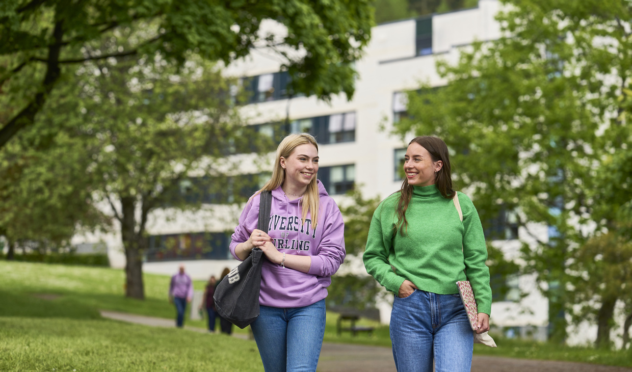 Two students walking near accommodation building