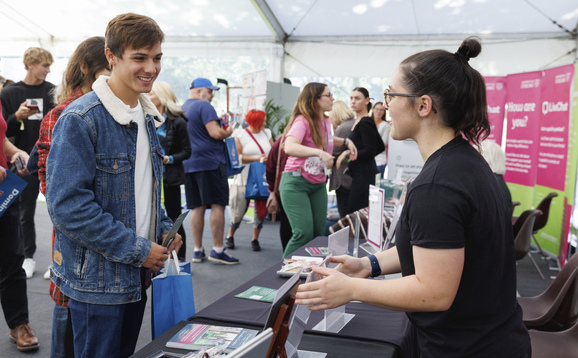 Students in the welcome week marquee