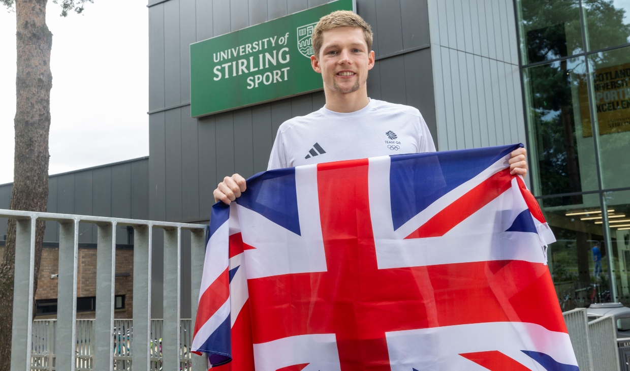 Duncan Scott poses with Union flag outside the University of Stirling.