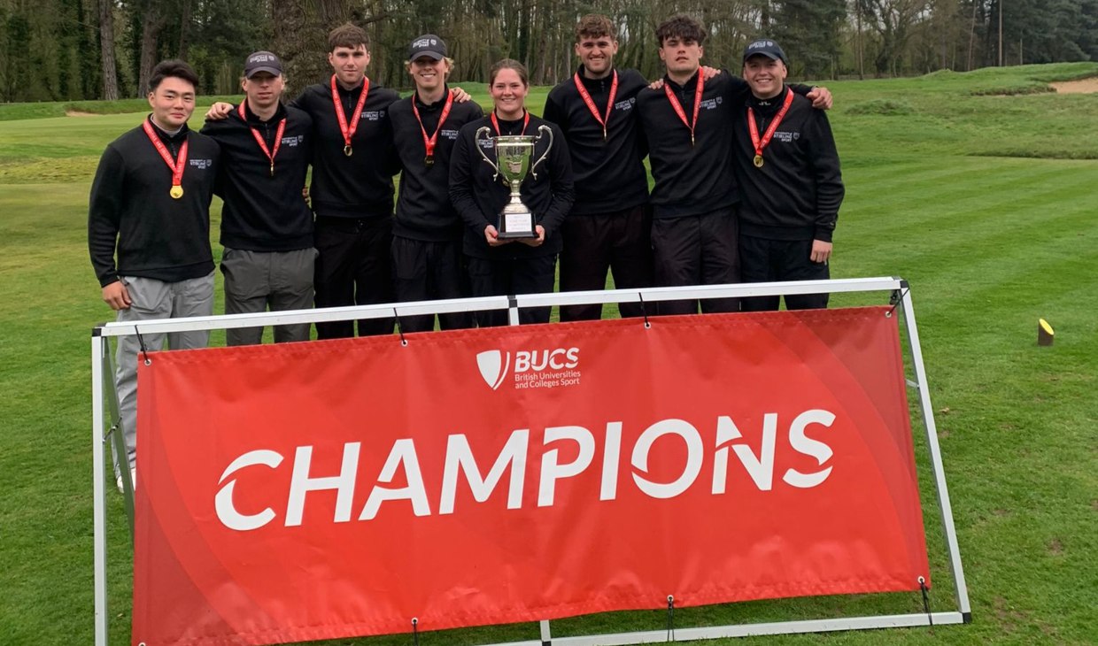 Golf team pictured as champions.