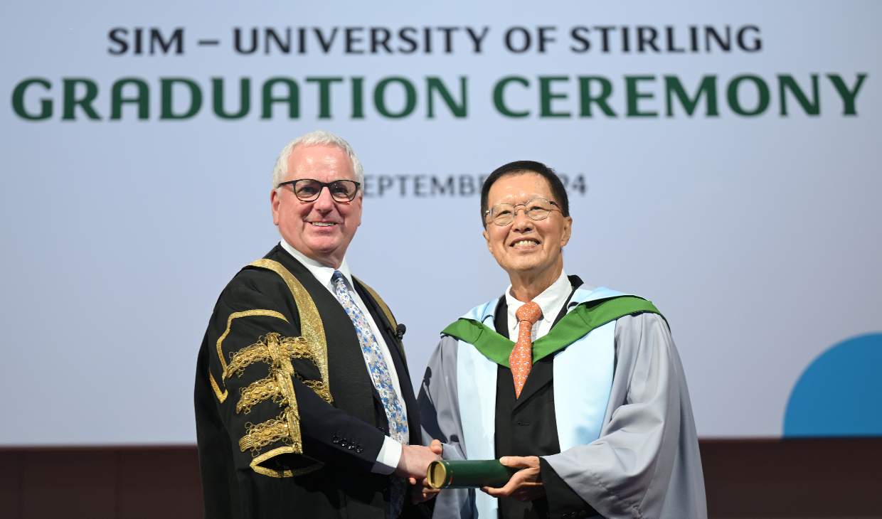 two men at graduation