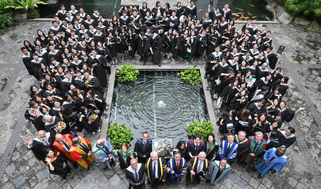 group standing outside at graduation