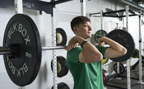 student lifting weights