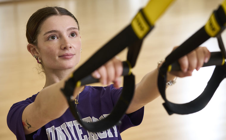 Student doing a TRX workout